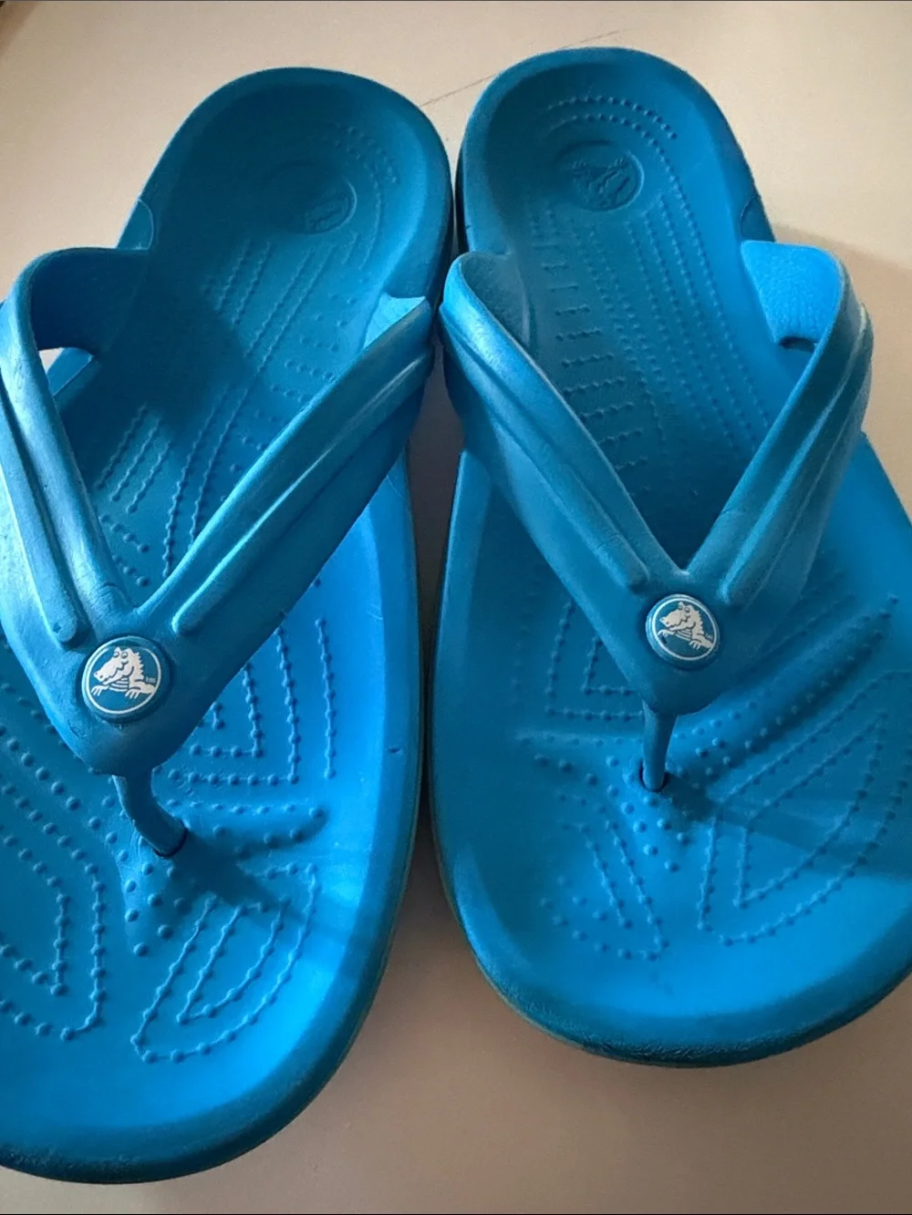 CROCS blue flip flops.  Men’s size 10. Fair condition.